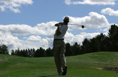 Golfer teeing off